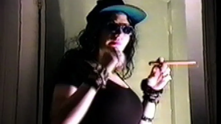 Arielle Smokes A Cigar