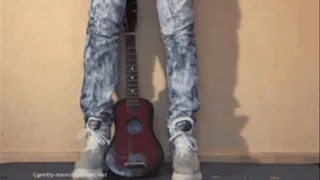 Small Guitar under cruel Shoes