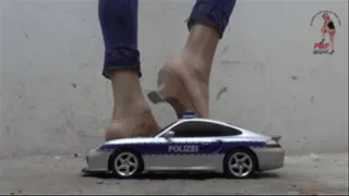 Car under naked Feet and wooden Mules (floor view)