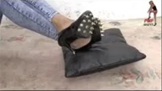 Leather Pillow under spiked Pumps