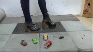 Cars crushed under wooden Clog