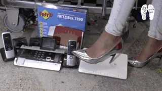 Electronic devices crushed under metal Heels