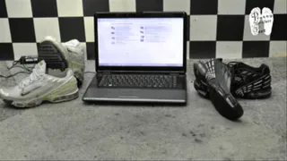 Expensive Notebook crushed unter pair of Sneakers