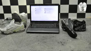 Expensive Notebook crushed unter two pair of Sneakers