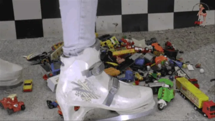 Toy cars and toy stuff under ice skating shoes