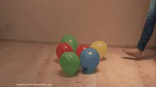 Balloons under pretty naked feet