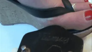 End of a guitar under sweet feet