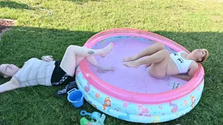 Dylan and Rhea pose in a pool