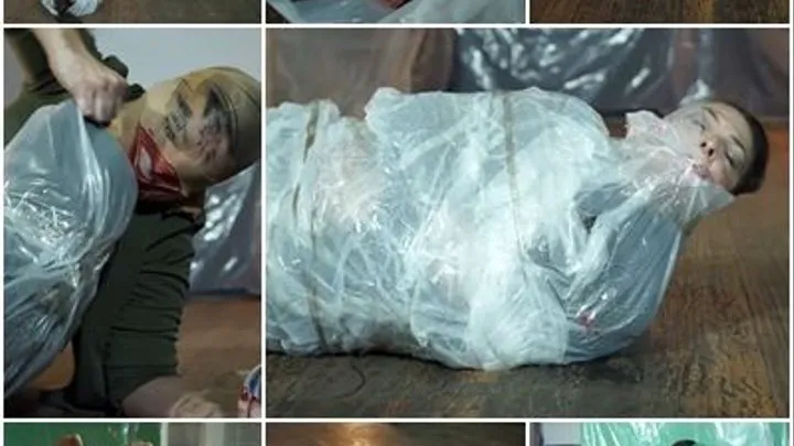 Pretty woman all wrapped up in plastic and taped up (partial clip)