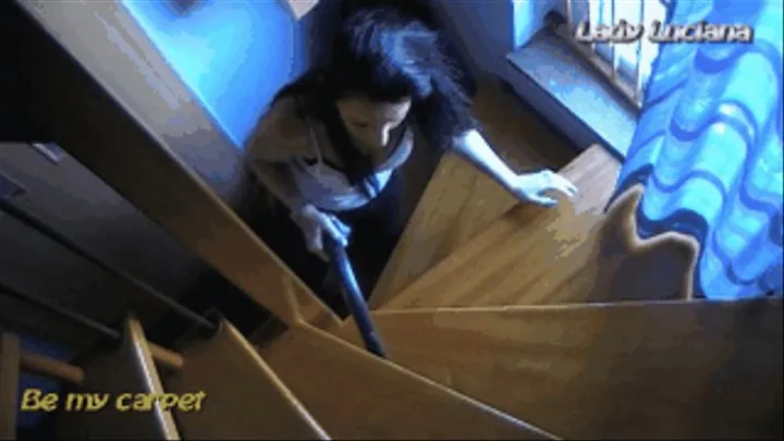 Lady Luciana vacuuming stairs