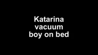 Katarina vacuum boy on bed