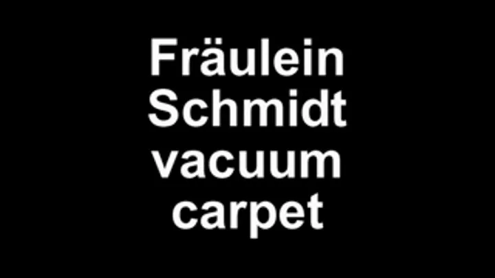 Mistress Schmidt vacuum the carpet