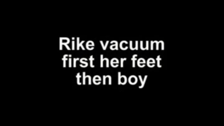 Rike vacuum first her feet then the boy