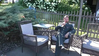 Swimming in a full green Army dress uniform in the pool