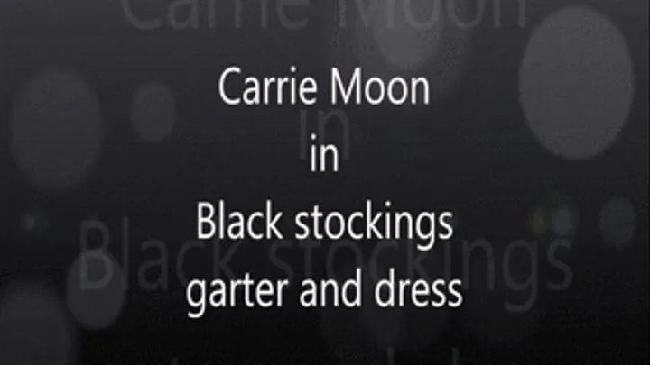 Carrie Moon in Black stockings, garter and black dress.. trying to get hubby to go out