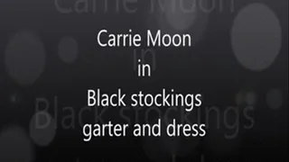 Carrie Moon in Black stockings, garter and black dress.. trying to get hubby to go out
