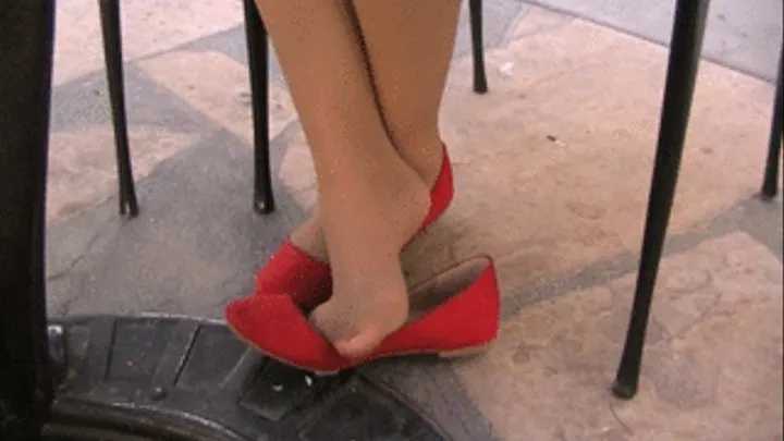 RT nylons with red flats at a mall patio table