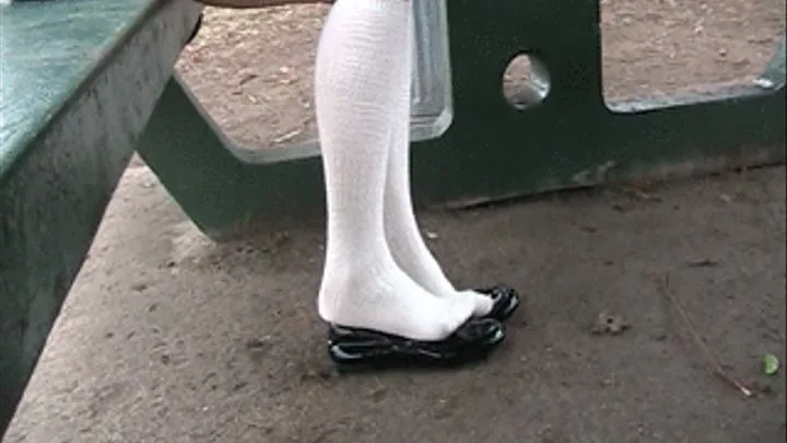 Black patent loafers & white knee high socks ~ park bench