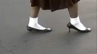Walking & shoeplay with one high heel broken