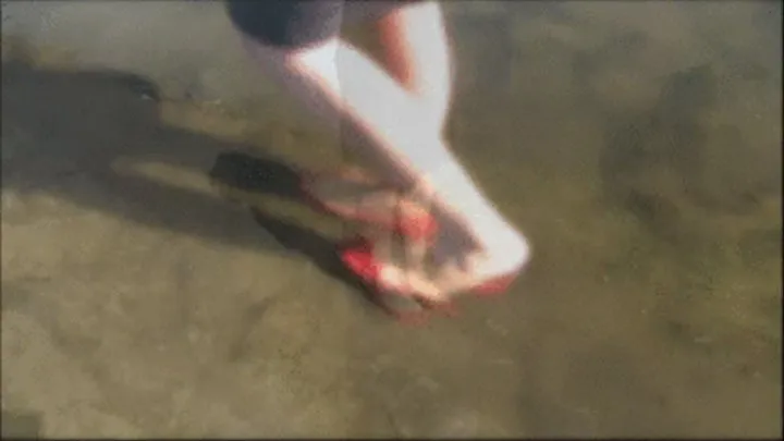 New low cut red flats barefoot in the water