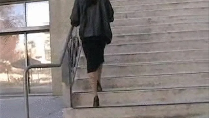 Black high heels crushed on stairs