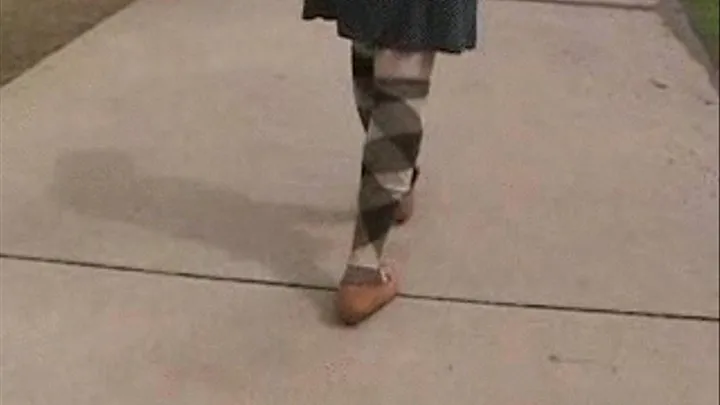 Walking out of her flats many times wearing knee socks