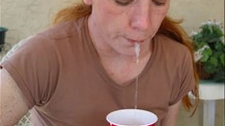 Penny spits in a cup