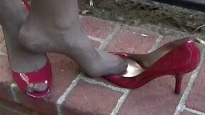 Red peep toes on the brick patio