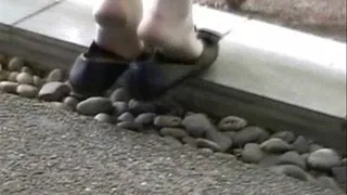 Shoeplay at a concrete table