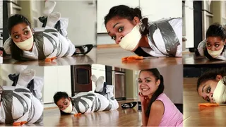 Cute Michelle Left Bound & Gagged in a Tight Sheet Tape Wrapped Hogtie Mummification