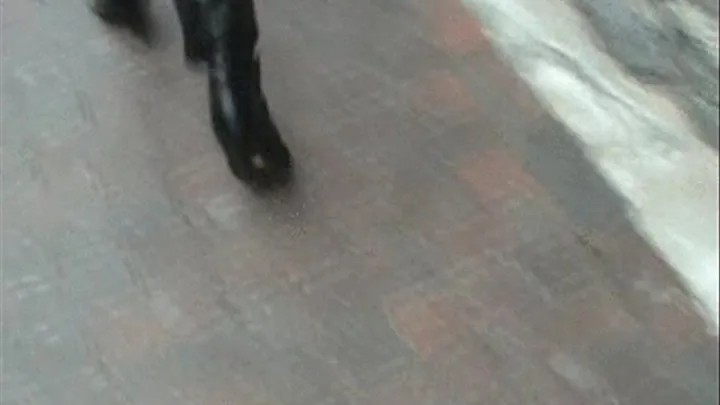 PORTIA WALKING ON COBBLESTONES WITH HER BLACK BOOTS