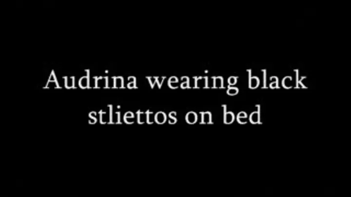 Audrina wearing black open toed stliettos while laying on the bed