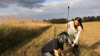 Lady Joy ride on the shoulders of her ponyboy