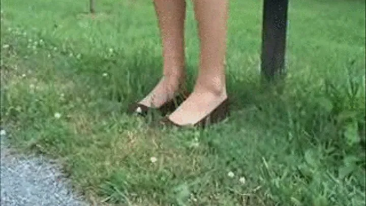 Flats barelegged on park bench