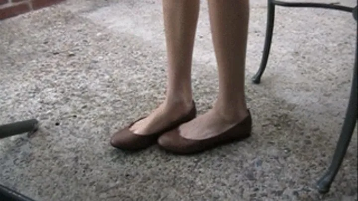 Brown flats barefoot standing at table