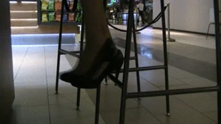 Black heels & nylons under counter @ mall 2