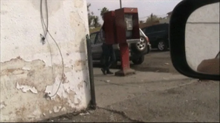 Black flats, black nylons & jeans at payphone