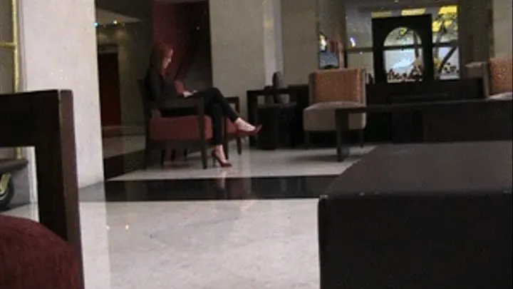 Red patent heels barefoot at hotel