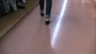 Black patent flats barefoot with jeans at store