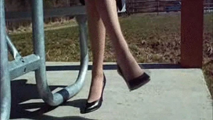 Black leather high heels ~ Shoeplay at a bench