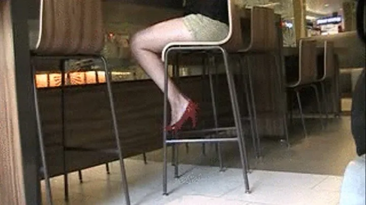 Red patent high heels at a bar