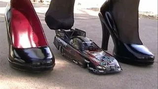 Funny car shoeplay with black patent high heels