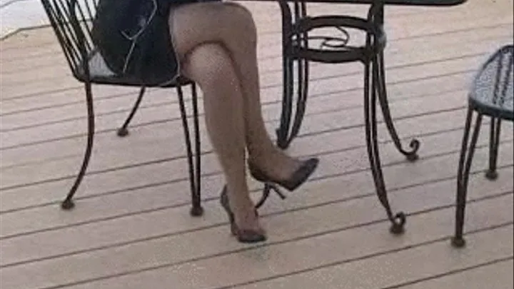 Black leather high heels ~ On a wood deck