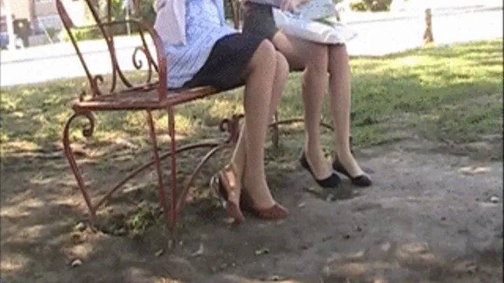 2 girls in flats at a park bench