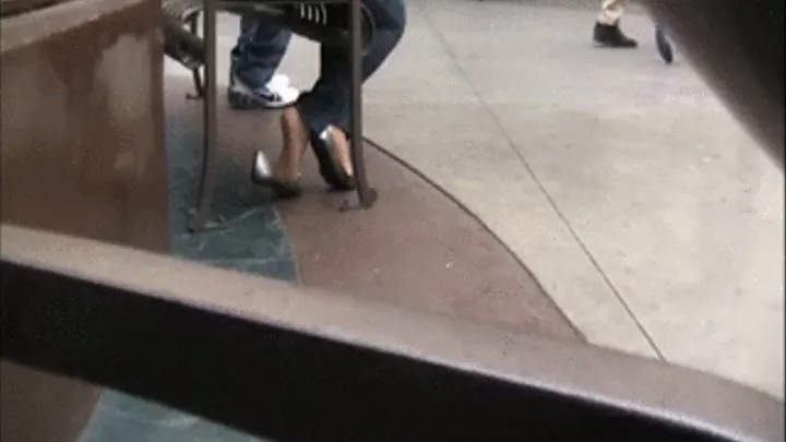 Silver flats & nylons sitting at the mall