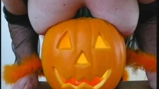 Tits squashed into a pumpkin