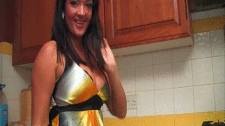SSF Bexey Mar dressed in a satin dress in the kitchen being fan blown