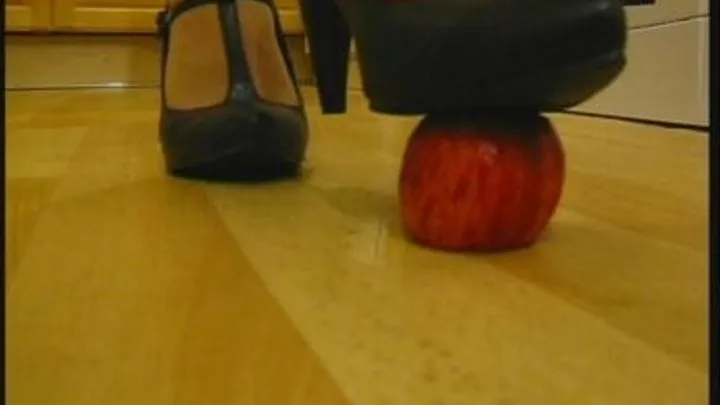 Crushes an apple with her heels
