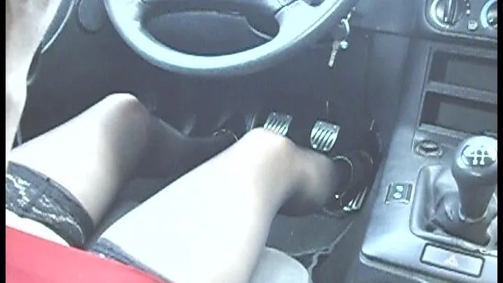 she is driving in her 5inch high heels pumps on the motorway