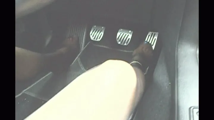 she is driving fast in pantyhose on the motorway